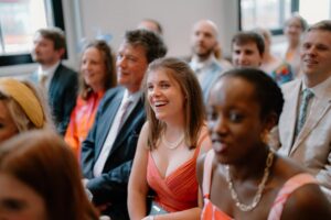 Smiling people at formal gathering