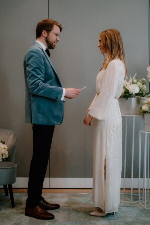 Couple exchanging vows during intimate wedding ceremony.