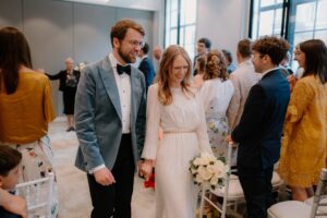 Bride and groom smiling during wedding ceremony