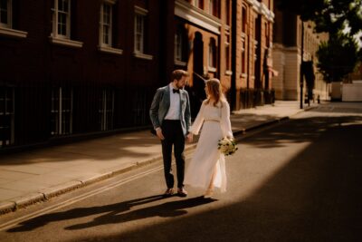 Couple walking together in warm sunlight
