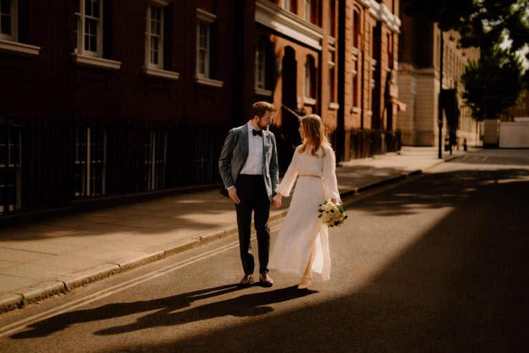 Couple walking together in warm sunlight