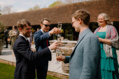 People toasting with champagne at outdoor gathering