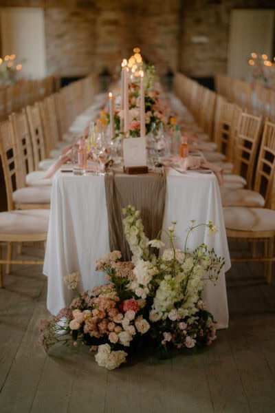 Elegant wedding table with flowers and candles.