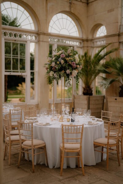 Elegant dining setup in grand conservatory