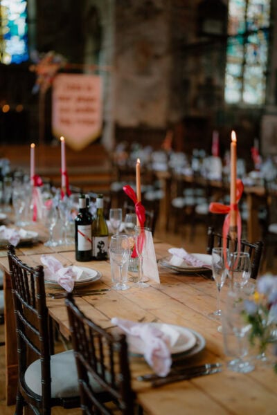 Rustic wedding table setting with candles.