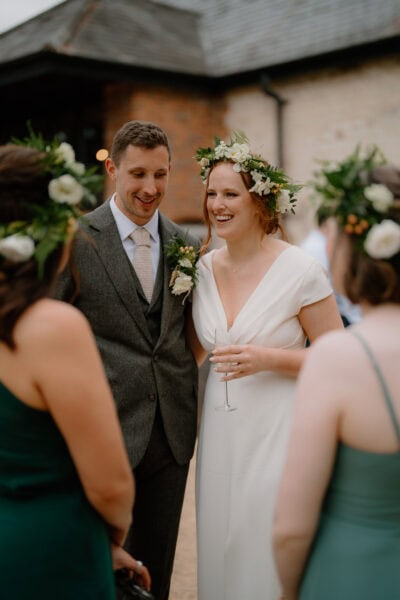 Happy wedding couple with flower crowns