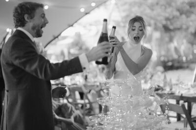 Couple celebrating with champagne at a wedding.