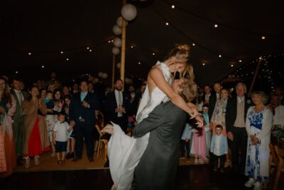 Happy couple dancing at wedding celebration.