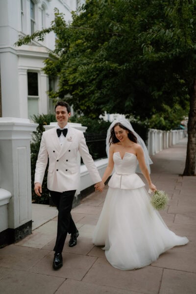 Bride and groom walking happily after wedding