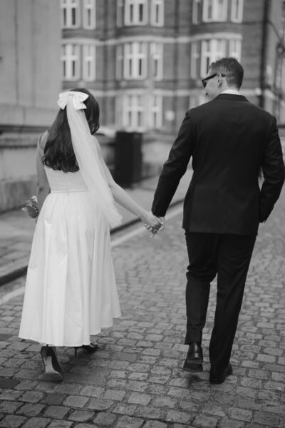 Bride and groom walking hand in hand